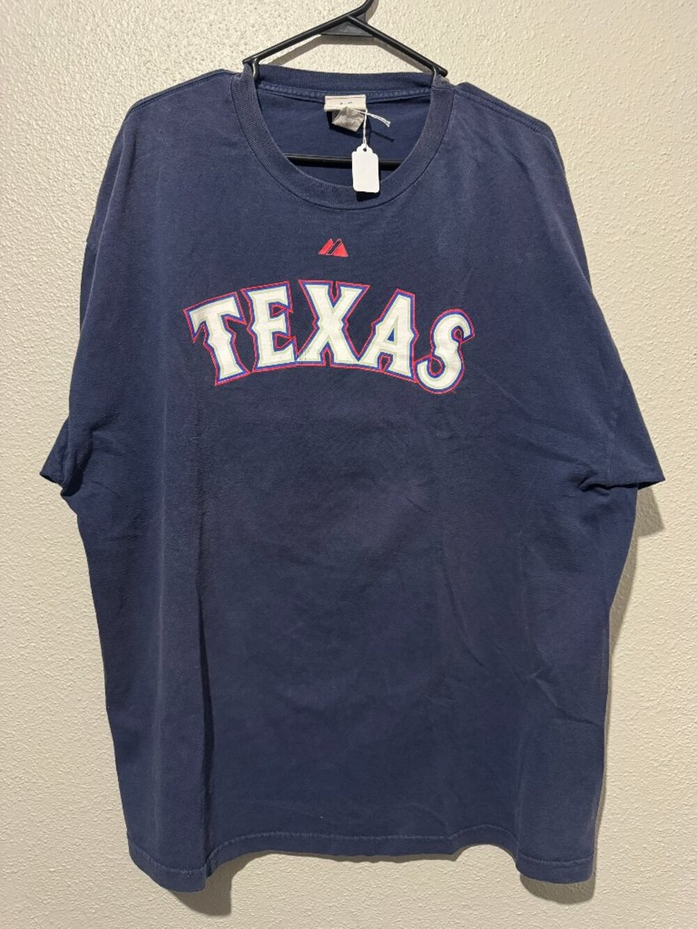 Majestic Texas Rangers short-sleeve T-shirt in navy blue featuring a large TEXAS